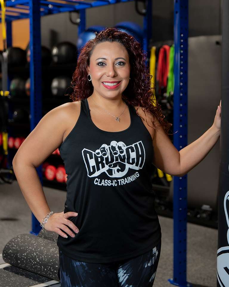 hispanic woman trainer at the crunch fitness gym