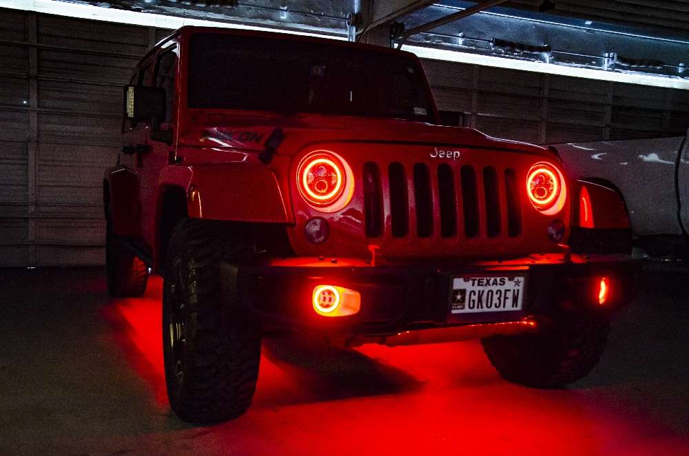 red jeep with lighting kit shot in dark garage