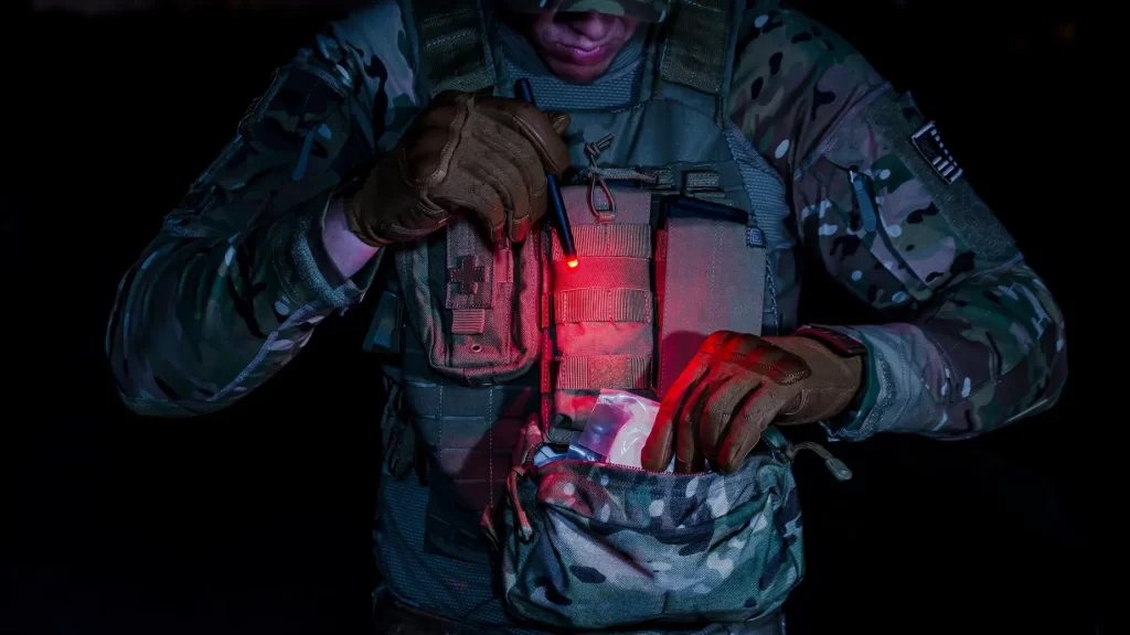 military soldier looking at this pack with a pen light shining red