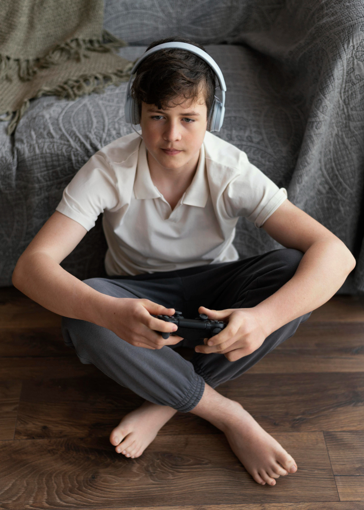 young boy with a controller in his hand playing a video game, marketing to children article