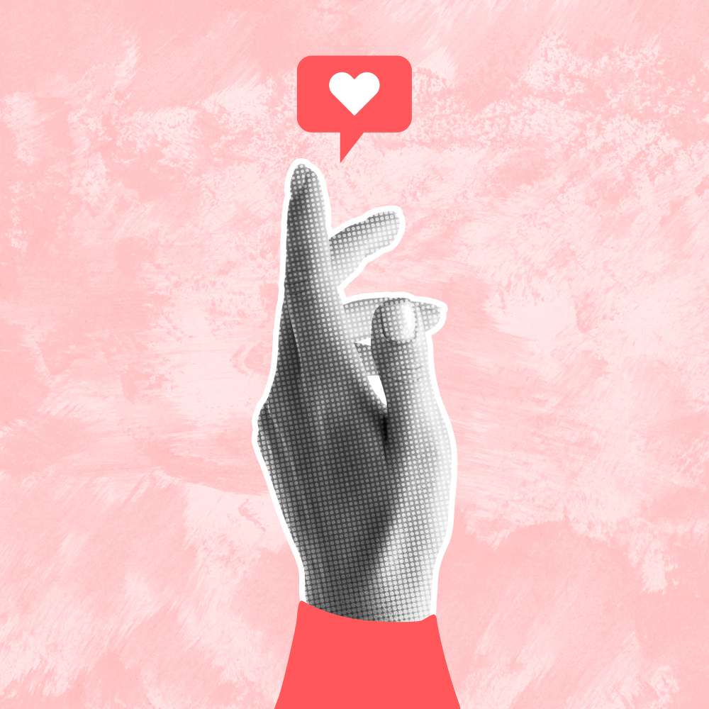 a hand reaching upwards towards a heart social media marketing icon